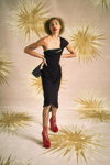 Vivienne Westwood SS21 campaign (looks: blackcocktail dress, black large mesh tights, red pumps)