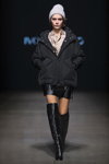 Ivo Nikkolo show — Riga Fashion Week SS23 (looks: grey knit cap, black jacket, black mini leather skirt, black knee high boots)