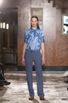 UNATTACHED show — Riga Fashion Week SS23 (looks: sky blue blouse, grey trousers)