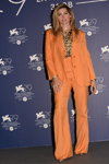Trace Lysette. Venice Film Festival 2022 (looks: orange pantsuit)