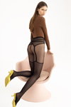 Modern Muse. Fiore AW 2021/22 lookbook (looks: black tights which imitate stockings, yellow pumps, brown jumper)