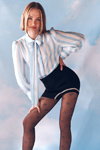 Looking for. Gabriella SS 2022 tights campaign (looks: white striped blouse, black tights)