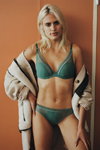 Stella Duval. Passionata by Chantelle FW22/23 lingerie campaign (looks: aquamarine bra, aquamarine briefs, blond hair)