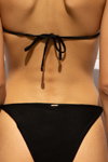 Sapia Simone 2022 swimwear campaign (looks: black swimsuit)