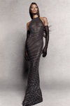 Naomi Campbell. PrettyLittleThing by Naomi Campbell campaign (looks: black long gloves, blackfittedevening dress)