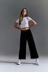 Denim Days. SiNSAY campaign (looks: white crop top, black jeans, white sneakers)
