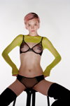 Chantelle X FW 23 lingerie campaign (looks: black boots, black bra, black briefs, yellow cropped jumper)